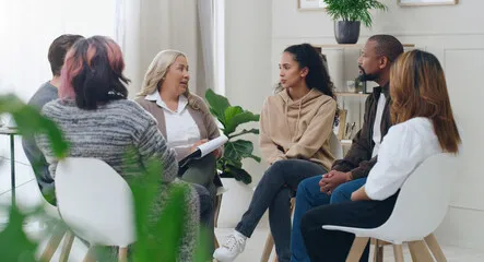 adults talking in a circle