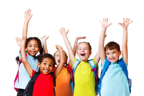 group of kids with arms in air