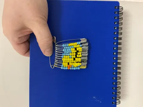 Duck made with beads on safety pins