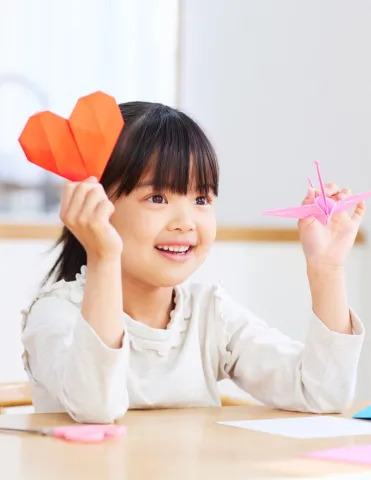 Girl Holding Origami