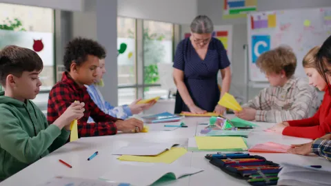 Teens sitting at a table 
